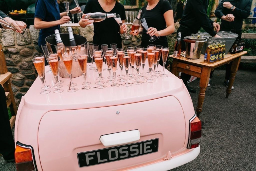 Wedding drinks reception using pink mini as a table